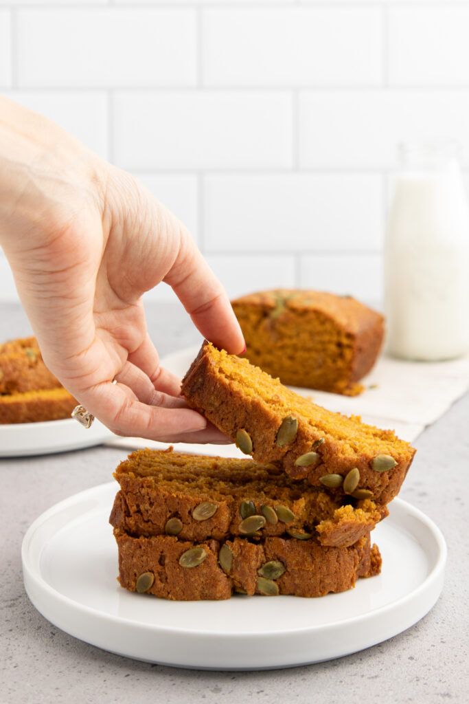 sliced pumpkin bread on a white plate