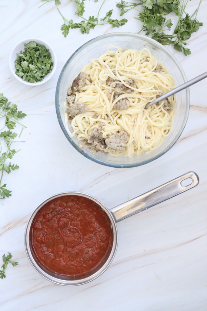 spaghetti and sausage in a bowl