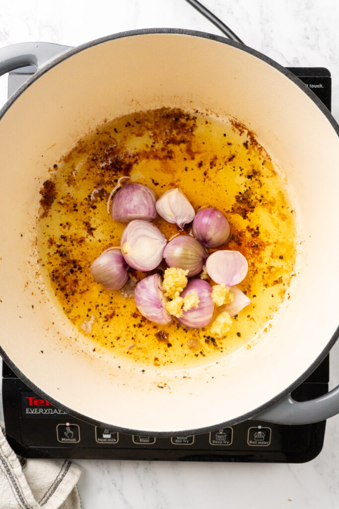 shallots and garlic in a Dutch oven