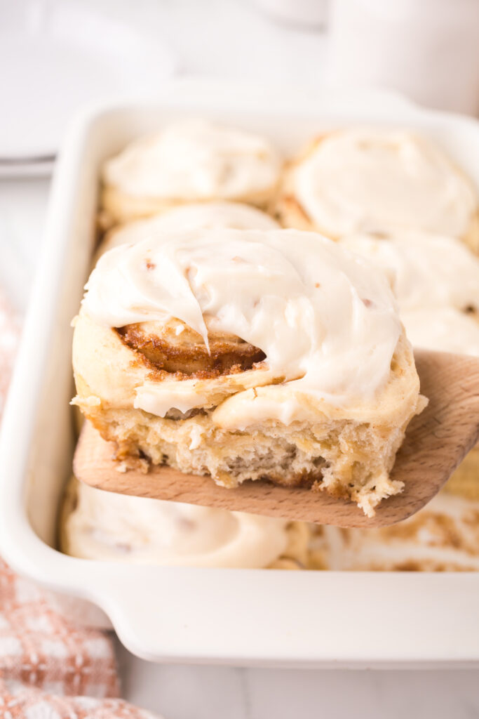 cinnamon rolls on a wooden spatula