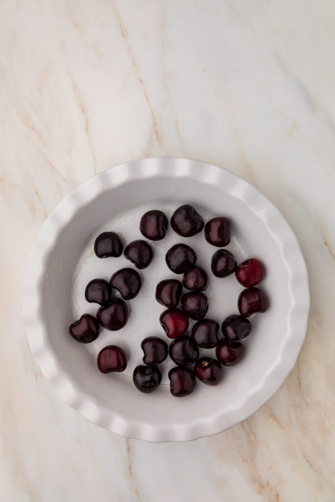 cherries in a white dish
