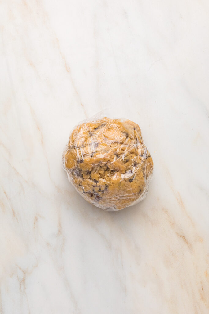 chocolate chip cookie dough wrapped in a plastic wrap